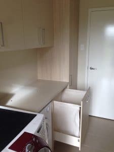 boutique laundry cabinets organising